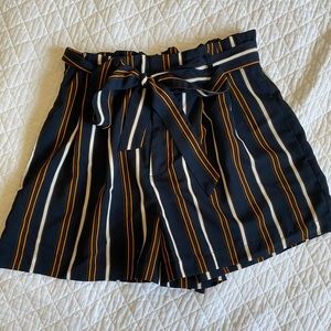 Navy blue shorts with a tie in the front